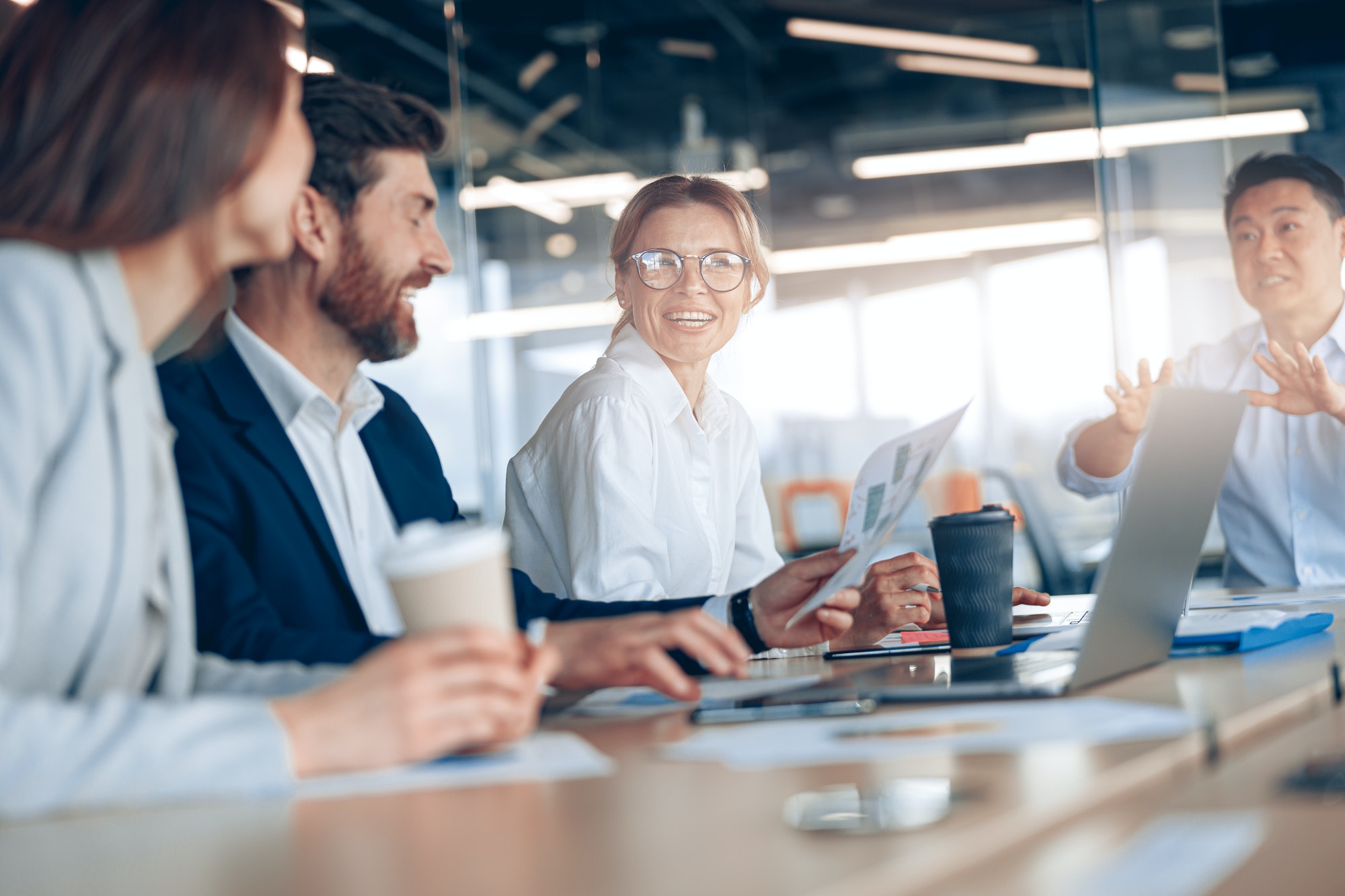 Group of modern, Lawyers, Businesspeople and Investors Gather at the Table in Corporate Meeting Room